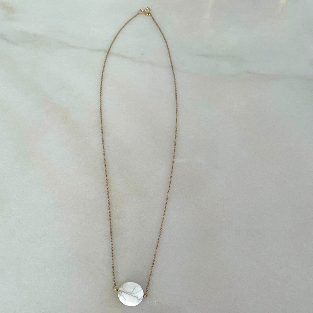 Gold necklace with marble stone